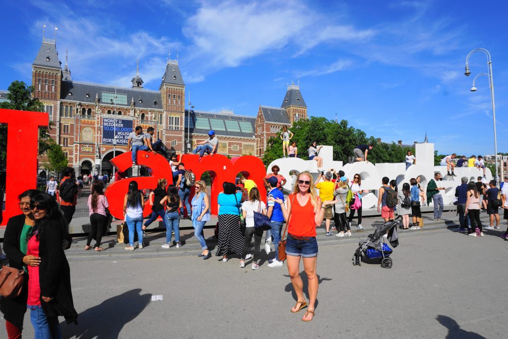 Rijksmuseum "I am Amsterdam" sign with a ton of people climbing on it